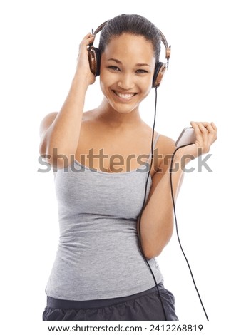 Happy woman, portrait and headphones listening to music for audio streaming against a white studio background. Female person smile enjoying sound track, podcast or playlist on smartphone with headset