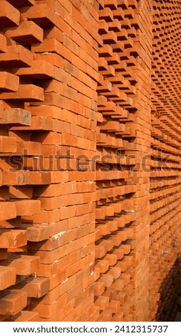 Close up of embossed reddish brown brick wall. Vintage texture background