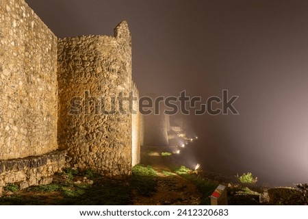 Walled town of Urueña. Outside the wall on a cold and foggy night. Valladolid, Castilla y León, Spain.