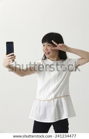 chinese girl self portrait with smart phone