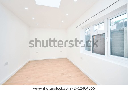 Brand New Refurbished Bedroom with Skylight Windows and empty neutral presentation in London UK