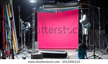 film set for background. filming location without people with a pink background and lighting equipment