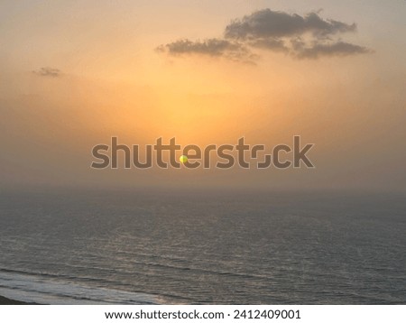 Sunset with slight Cloud Formations over the Mediterranean Sea Amazing View   Royalty-Free Stock Photo #2412409001