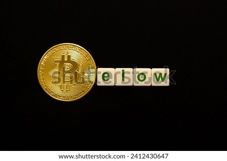 Word Below made up of cubes. The first letter symbolized by bitcoin coin. Weak BTC concept, bitcoin price falls, negative BTC price outlook.
