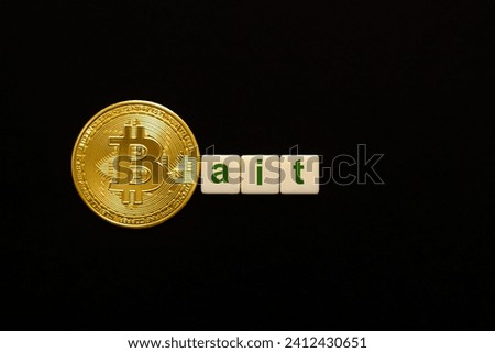 Word Bait made up of cubes. The first letter symbolized by bitcoin coin. Weak BTC concept, bitcoin price falls, negative BTC price outlook.