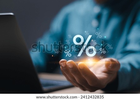 Interest rate finance and mortgage rates concept. Person holding virtual percentage icons. financial growth, interest rate increase, inflation, sale price and tax rise.
