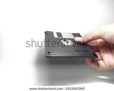 Magelang 14 January 2024-A floppy disk with an isolated white background, used as a place to store data when the technology is not yet sophisticated