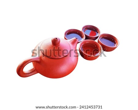 The white background in the picture is a container of hot water in an orange jar and four small cups for drinking hot tea, used in the morning and before or after dinne
