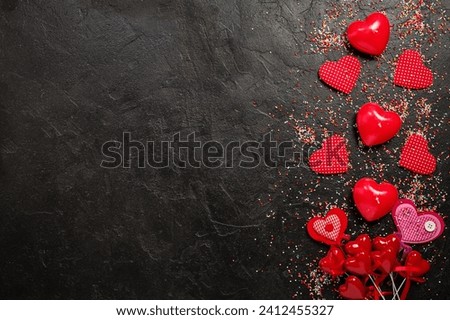 valentine's day background with heart shapes on black table Royalty-Free Stock Photo #2412455327