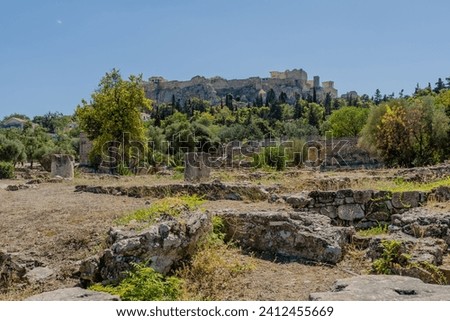 Landscape of ancient agora with the acropolis in background.