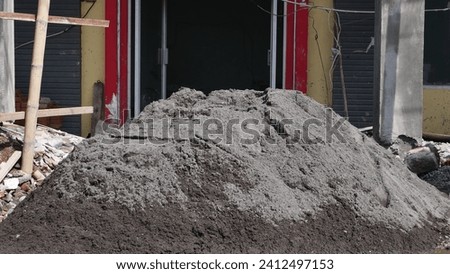 A heap of soil and cement mix for making concrete at a construction site