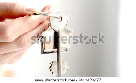 the girl holds the keys to the new apartment. High quality photo