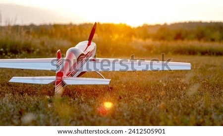 Radio-controlled model aircraft at sunset. High quality photo