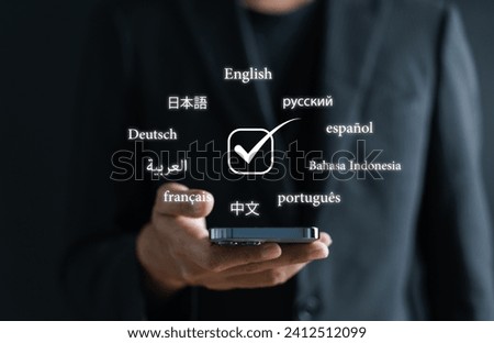 Businessman using  translation or translate on the mobile app worldwide language conversation speaking concept.	
