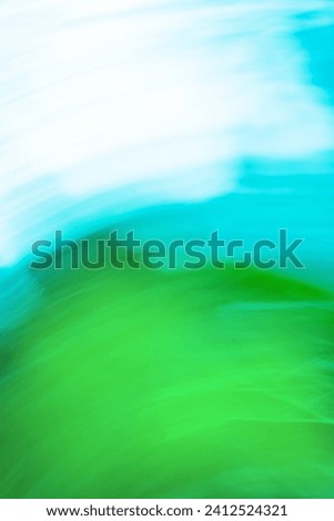 Green defocused dynamic abstract background. Long time exposure motion blur