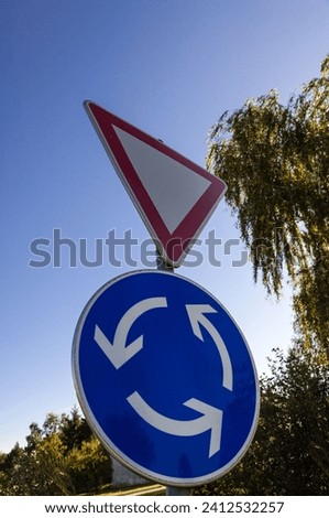 A sign roundabout and give-way, traffic sign