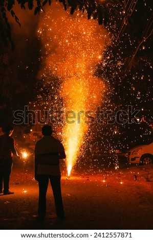 A vertical shot of crackers burning in the street on Diwali night for celebrating the festival in India