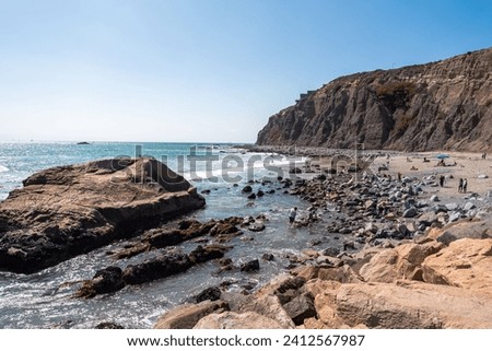 A beautiful shot of the sunny rocky shore of Dana Point, California