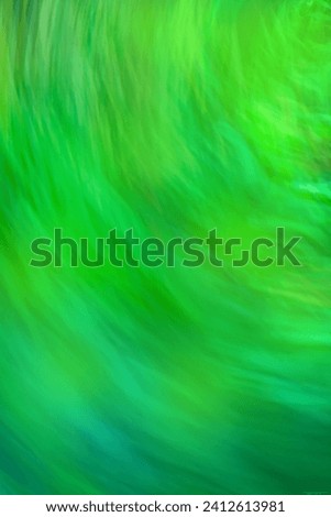 Green slow shutter speed with motion blur effect. Decorative backdrop fast speedy motion no focus. 