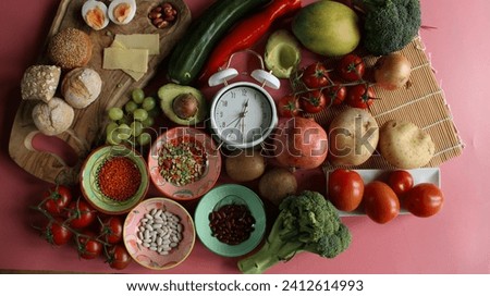 Clock diet food intermittend fasting fitness sport metabolic nutrition muscles gains weight loss time-restricted feeding keto plan metabolism mediterranean obesity vegetables, fruits, bodybuilding Royalty-Free Stock Photo #2412614993