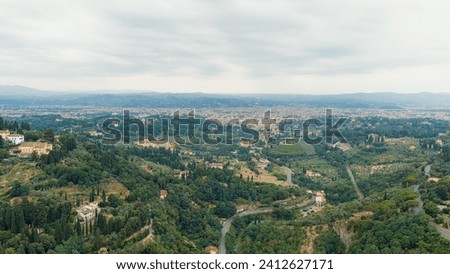 Florence, Italy. General view of the city in cloudy weather. Summer, Aerial View   Royalty-Free Stock Photo #2412627171