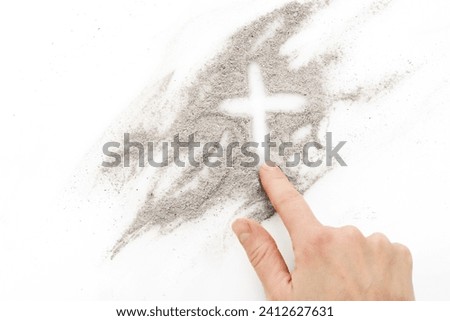 Cross made of ashes, Ash Wednesday, Lent season abstract background Royalty-Free Stock Photo #2412627631