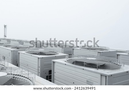 System of central compressor machine part of air conditioner system set on the roof building isolated on white background.Row of compressor air conditioner.