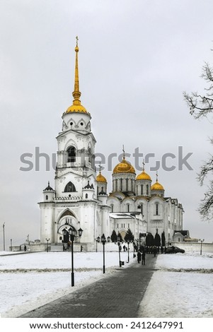 Assumption Cathedral in Vladimir.
White-stone church of the Russian Orthodox Church with golden domes. Winter view