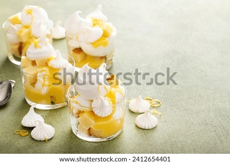Lemon meringue parfait or trifle with pound cake, whipped cream and lemon curd