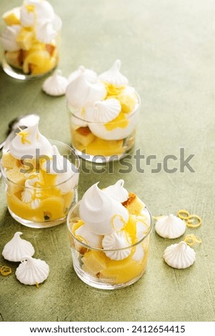 Lemon meringue parfait or trifle with pound cake, whipped cream and lemon curd