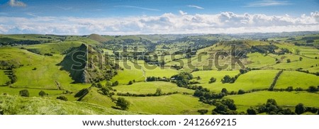 Park Hill viewed from Chrome Hill on a cold and windy in the Peak District, taking in the panoramic view of famrland to the West Royalty-Free Stock Photo #2412669215