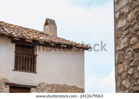 Vintage stone houses in picturesque medieval town. Old charming streets. Typical village with stone facades. Architecture and sights of Spain.