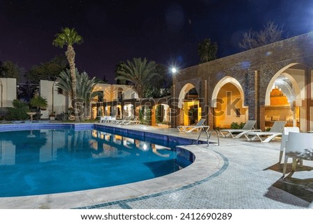 Ouarzazate Morocco. Beautiful city in the atlas mountains of Morocco. Karam Palace Hotel at night Royalty-Free Stock Photo #2412690289