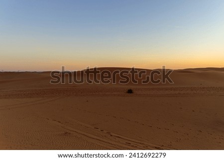 Sahara Desert sand dunes background. Popular travel destination, Erg Chebbi, Sahara Desert, Morocco.Erg Chebbi Royalty-Free Stock Photo #2412692279