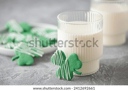 Green Clover Leaf Form. Homemade Shamrock Cookies for Saint Patricks day and milk glasses