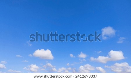 video of white clouds with a blue sky background during the day