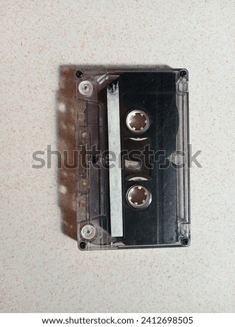 cassette tape which is usually used to record or listen to songs in old tape radio
