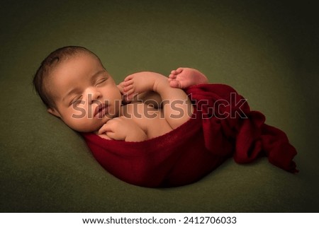 Cute little sleeping African biracial newborn baby sleeping on a dark olive green backdrop Royalty-Free Stock Photo #2412706033