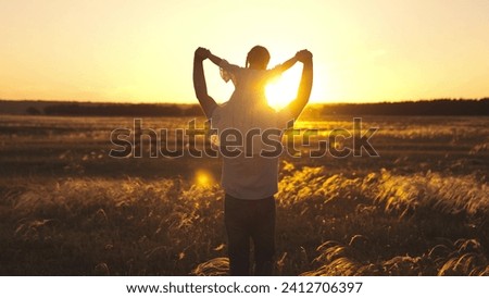 Parent inspired by beauty of evening spent with daughter to paint picture in future. Parent and daughter seeking for place to have picnic in field. Parent holding child on shoulders sunbathing