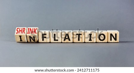 Inflation or shrinkflation symbol. Concept words Inflation Shrinkflation on beautiful wooden blocks. Beautiful grey table grey background. Business inflation shrinkflation concept. Copy space Royalty-Free Stock Photo #2412711175