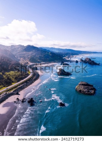 a fine art landscape drone photography image of the dreamy Oregon Coast during a beautiful sunny golden hour. 