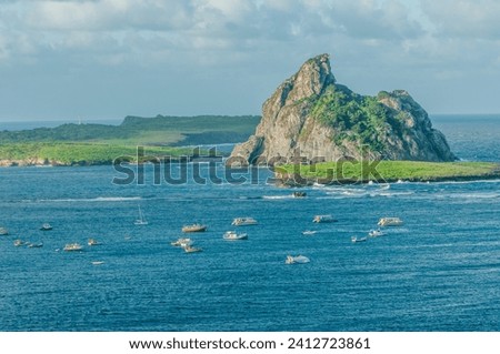 Sela Gineta Rock, Composed of phonolitic rock, is located between the Rasa and Meio islands, in the Fernando de Noronha Archipelago Royalty-Free Stock Photo #2412723861