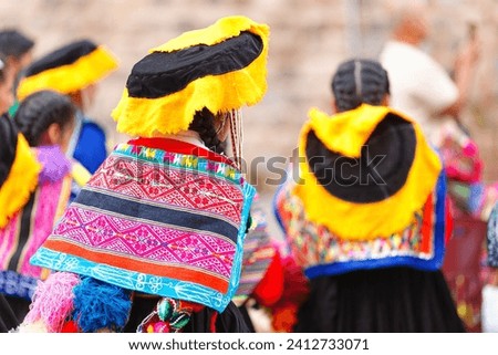 Peruvian women with traditional clothes in the historical center of Cusco.