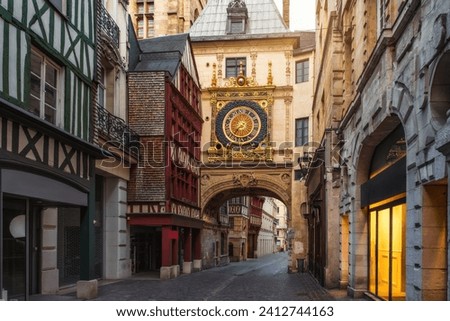 Medieval cozy street in Rouen with famos Great clocks or Gros Horloge of Rouen, Normandy, France with nobody. Architecture and landmarks of Normandie Royalty-Free Stock Photo #2412744163
