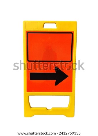 Floor-standing folding sign warning the road to follow the black arrow for safety on a white background.