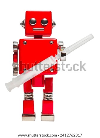 Isolated photo of red toy robot holding syringe on white background.