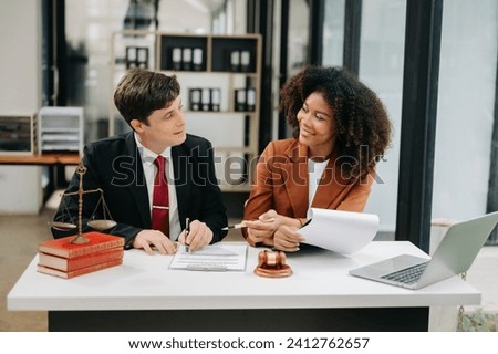 portrait of business people and lawyers discussing contract papers sitting at the table. Concepts of law, advice, legal services. in morning light
