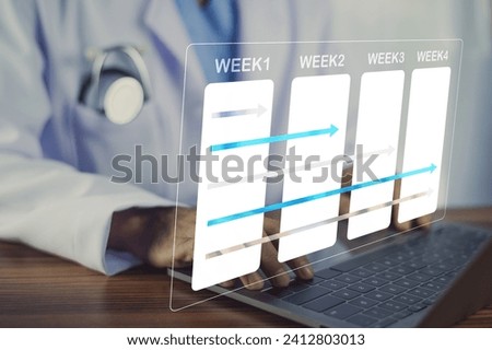 Doctors are using calendars to schedule treatment plans for patients and make appointments to monitor patients' conditions through Internet computer technology. Royalty-Free Stock Photo #2412803013