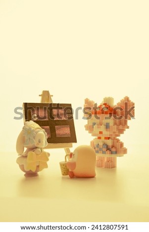 children's toys on the table on a yellow background
