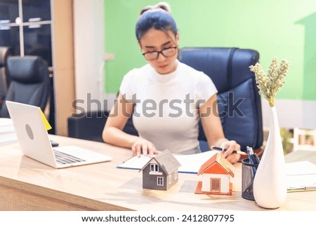 Businesswoman selling house real estate agent at office desk. Women working home insurance mortgage sale apartment. Asian women dealership real estate rental home. Businessperson agency sign contract